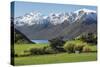 Rural scene of Lake Wanaka backed by snow capped mountains, New Zealand-Ed Rhodes-Stretched Canvas