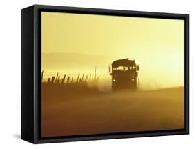 Rural School Bus Driving Along Dusty Country Road, Oregon, USA-William Sutton-Framed Stretched Canvas