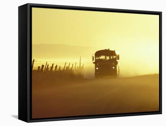 Rural School Bus Driving Along Dusty Country Road, Oregon, USA-William Sutton-Framed Stretched Canvas