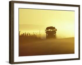 Rural School Bus Driving Along Dusty Country Road, Oregon, USA-William Sutton-Framed Photographic Print