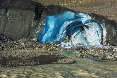 Blue ice and meltwater at the toe of the Athabasca Glacier, Jasper National Park, Alberta, Canada
