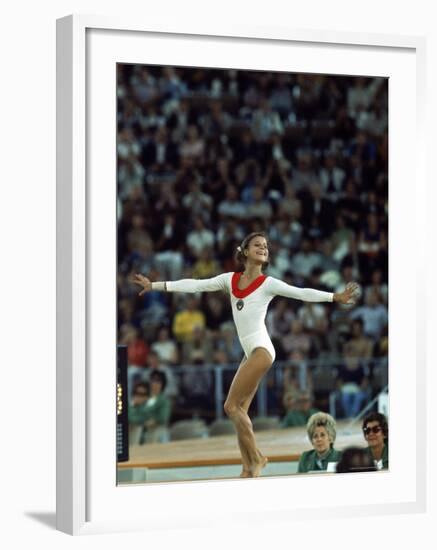 Russian Gymnast Olga Korbut Performing Floor Exercises at Summer Olympics-John Dominis-Framed Premium Photographic Print