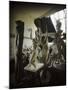 Russian Sculptor Ossip Zadkine Sitting in His Paris Studio Among Towering Sculptures-Gjon Mili-Mounted Premium Photographic Print