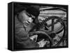 Russian Steel Worker Turning Gear Wheel in a Steel Mill-Margaret Bourke-White-Framed Stretched Canvas