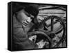 Russian Steel Worker Turning Gear Wheel in a Steel Mill-Margaret Bourke-White-Framed Stretched Canvas