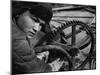 Russian Steel Worker Turning Gear Wheel in a Steel Mill-Margaret Bourke-White-Mounted Photographic Print