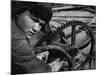 Russian Steel Worker Turning Gear Wheel in a Steel Mill-Margaret Bourke-White-Mounted Photographic Print