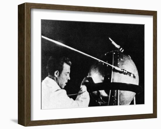 Russian Technician with Sputnik 1-null-Framed Photo