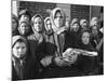 Russian Woman Grimly Holding a Slab of Meat as Other Peasant Women Staunchly Stand by in Siberia-Margaret Bourke-White-Mounted Photographic Print