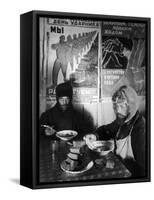 Russian Workers Eating Black Bread and Soup at Table with Soviet Communist Workers Posters, Siberia-Margaret Bourke-White-Framed Stretched Canvas