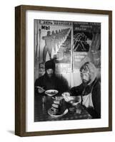 Russian Workers Eating Black Bread and Soup at Table with Soviet Communist Workers Posters, Siberia-Margaret Bourke-White-Framed Photographic Print