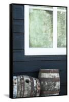 Rustic Barrels Lined Up Along an Old House Below a Window-Sheila Haddad-Framed Stretched Canvas