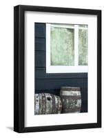 Rustic Barrels Lined Up Along an Old House Below a Window-Sheila Haddad-Framed Photographic Print