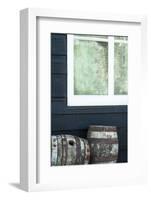 Rustic Barrels Lined Up Along an Old House Below a Window-Sheila Haddad-Framed Photographic Print