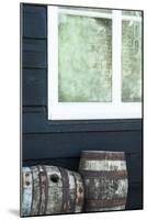 Rustic Barrels Lined Up Along an Old House Below a Window-Sheila Haddad-Mounted Photographic Print