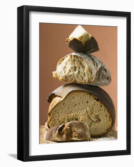 Rustic Bread, Two Loaves with Pieces Cut Off in a Pile-null-Framed Photographic Print