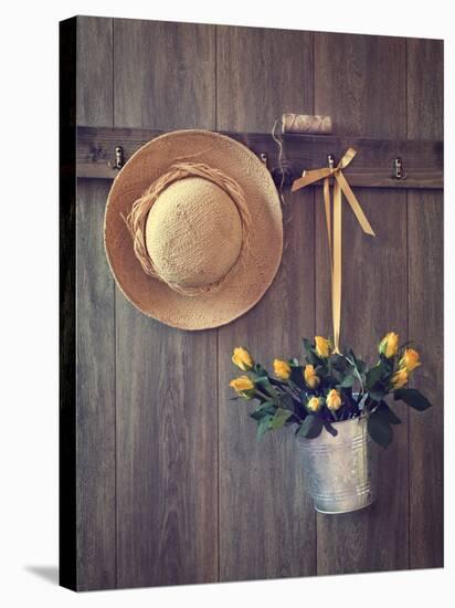 Rustic Shed Door with Hanging Straw Hat and Bucket of Yellow Roses-Chris_Elwell-Stretched Canvas
