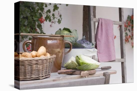 Rustic Still Life with Potatoes and Cabbage in Front of Farmhouse-Eising Studio - Food Photo and Video-Stretched Canvas