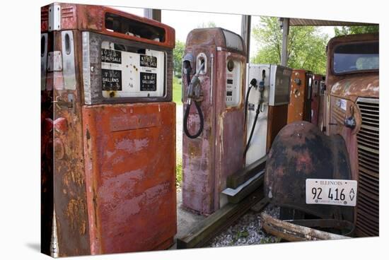 Rusty Gas Pumps And Car-Mark Williamson-Stretched Canvas