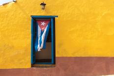 Cuban Flag Hanging on a Door in Trinidad, Cuba-Sabino Parente-Framed Stretched Canvas