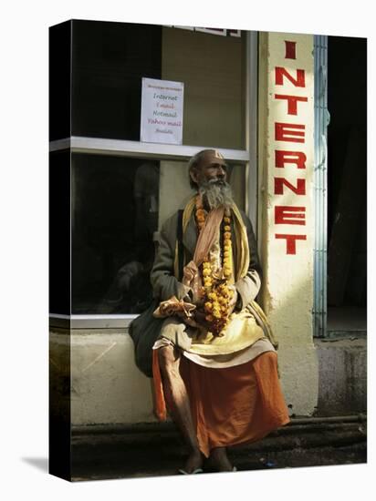 Sadhu Sitting Outside an Internet Cafe, Varanasi, Uttar Pradesh State, India-James Gritz-Stretched Canvas