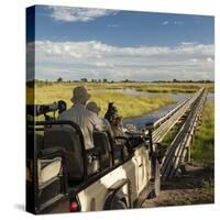 Safari Vehicle Crossing Bridge-Michele Westmorland-Stretched Canvas