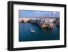 Sail boat anchored in the water off the white village of Polignano a Mare at sunset, Bari province-Paolo Graziosi-Framed Photographic Print