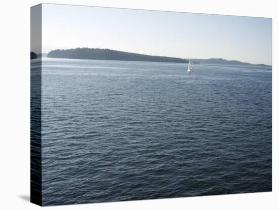 Sailboat on the Puget Sound Passes Blake Island, Washington State, United States of America-Aaron McCoy-Stretched Canvas