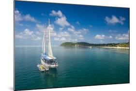 Sailing boat anchoring on Mana Island, Mamanuca Islands, Fiji, South Pacific-Michael Runkel-Mounted Photographic Print