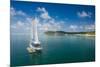 Sailing boat anchoring on Mana Island, Mamanuca Islands, Fiji, South Pacific-Michael Runkel-Mounted Photographic Print