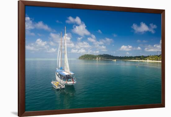 Sailing boat anchoring on Mana Island, Mamanuca Islands, Fiji, South Pacific-Michael Runkel-Framed Photographic Print