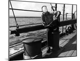 Sailor Relaxing Aboard a Us Navy Cruiser at Sea While Reading a Copy of Life Magazine During WWII-Ralph Morse-Mounted Photographic Print