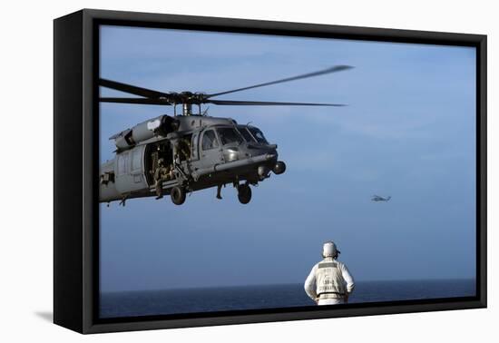 Sailor Watches an Air Force Hh-60G Pave Hawk Helicopter Prepare to Land-null-Framed Stretched Canvas