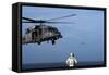 Sailor Watches an Air Force Hh-60G Pave Hawk Helicopter Prepare to Land-null-Framed Stretched Canvas