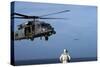 Sailor Watches an Air Force Hh-60G Pave Hawk Helicopter Prepare to Land-null-Stretched Canvas