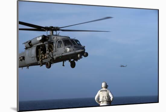 Sailor Watches an Air Force Hh-60G Pave Hawk Helicopter Prepare to Land-null-Mounted Photographic Print