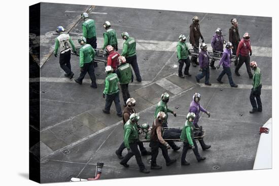 Sailors Carry Stretchers in Response to a Mass Casualty Drill-null-Stretched Canvas