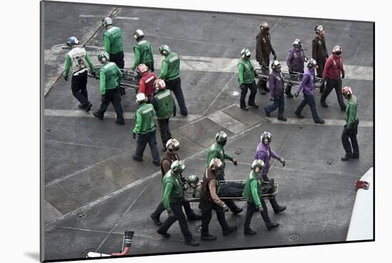 Sailors Carry Stretchers in Response to a Mass Casualty Drill-null-Mounted Photographic Print