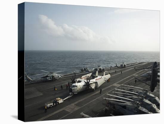 Sailors Move a C-2A Greyhound across the Flight Deck of USS Nimitz-null-Stretched Canvas