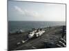 Sailors Move a C-2A Greyhound across the Flight Deck of USS Nimitz-null-Mounted Photographic Print