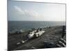 Sailors Move a C-2A Greyhound across the Flight Deck of USS Nimitz-null-Mounted Photographic Print