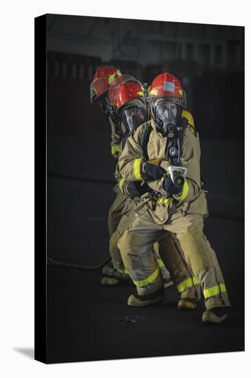 Sailors Practice Firefighting in the Hangar Bay of USS Nimitz-null-Stretched Canvas