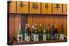 Sake Bottles in a Sake Brewery, Takayama, Gifu Prefecture, Japan-Stefano Politi Markovina-Stretched Canvas