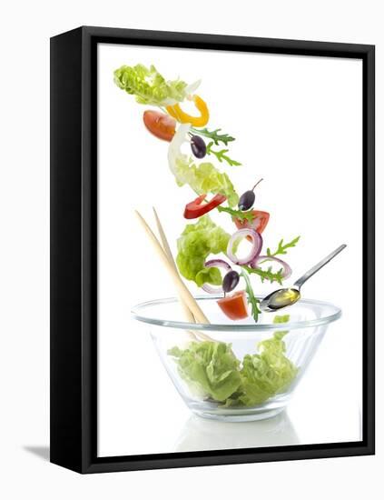 Salad Ingredients Falling into a Glass Bowl-Caroline Martin-Framed Stretched Canvas