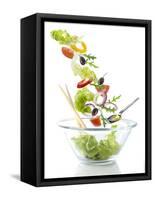 Salad Ingredients Falling into a Glass Bowl-Caroline Martin-Framed Stretched Canvas