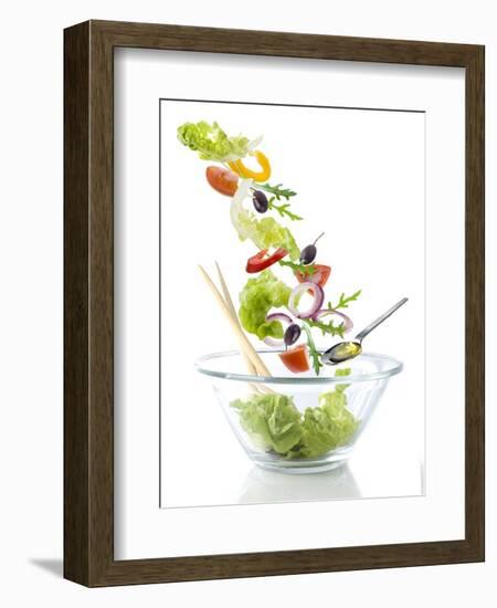 Salad Ingredients Falling into a Glass Bowl-Caroline Martin-Framed Photographic Print