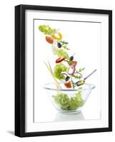 Salad Ingredients Falling into a Glass Bowl-Caroline Martin-Framed Photographic Print