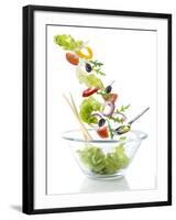 Salad Ingredients Falling into a Glass Bowl-Caroline Martin-Framed Photographic Print