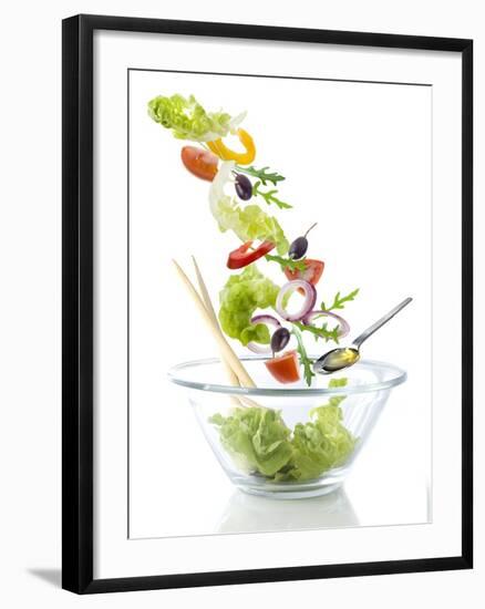 Salad Ingredients Falling into a Glass Bowl-Caroline Martin-Framed Photographic Print