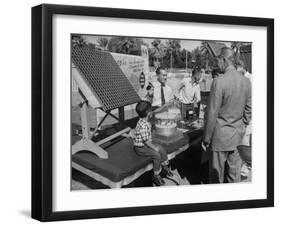 Salesman Demonstrating Solar Battery at the International Conference on Solar Energy-J^ R^ Eyerman-Framed Photographic Print